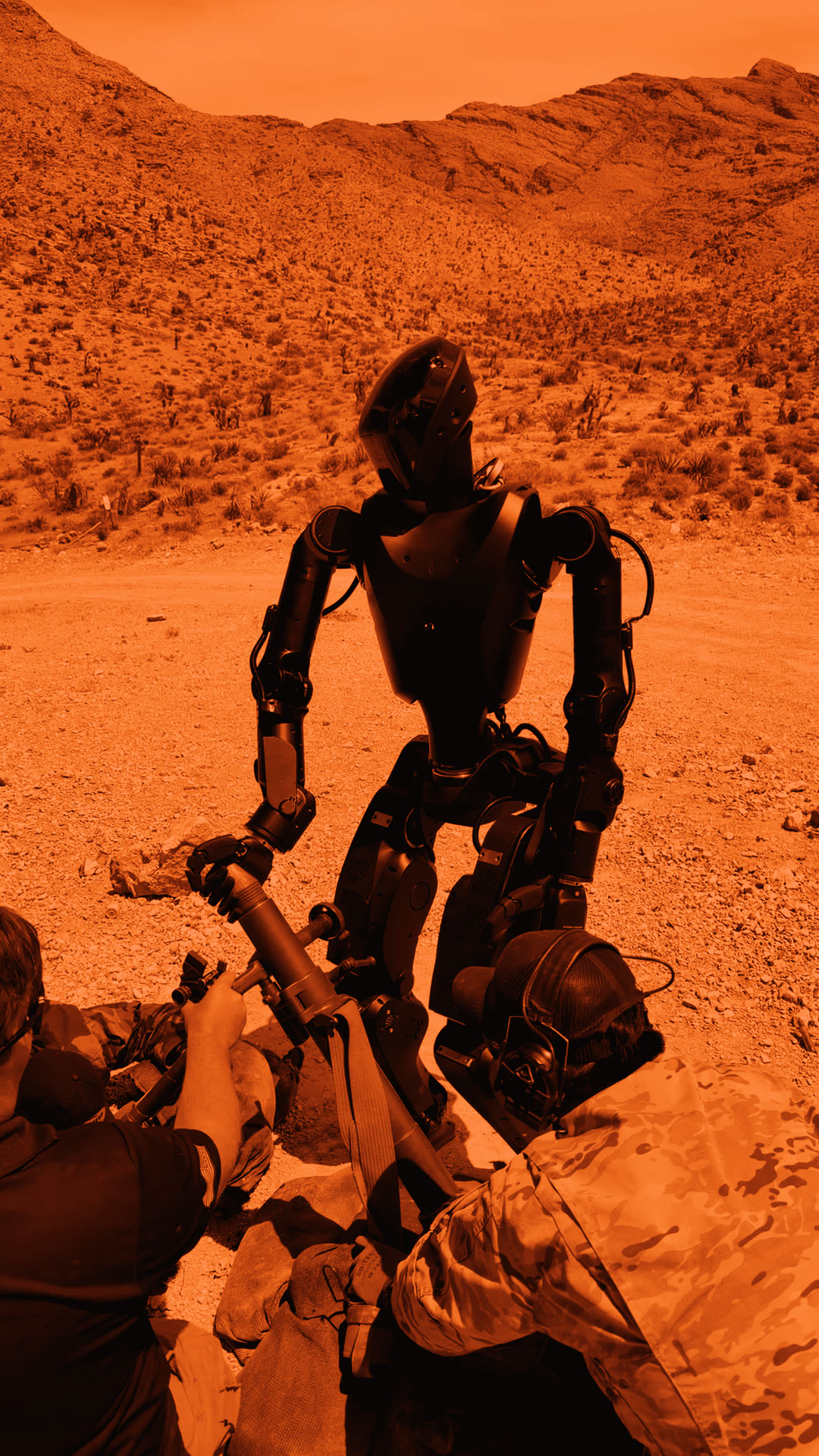 Phantom MK1 humanoid standing over a mortar tube in the desert, unmanned